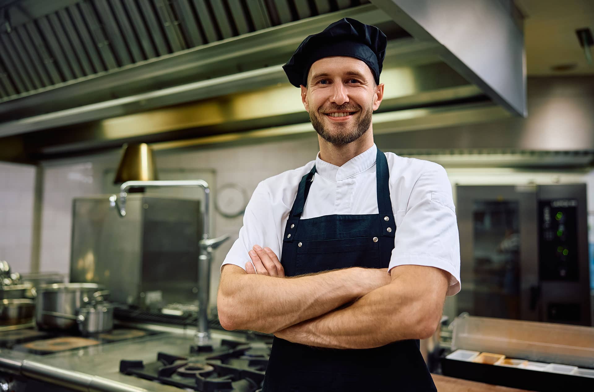 cook in kitchen with clean grease trap